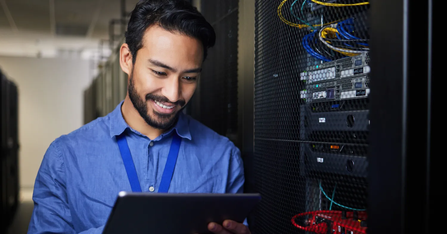 Network Administrator Smiling at the screen